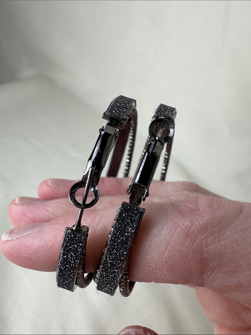 Bundle of Sparkly Multi-Tone Hoop Earrings in Gold, Silver, and Black - Picture 5 of 8